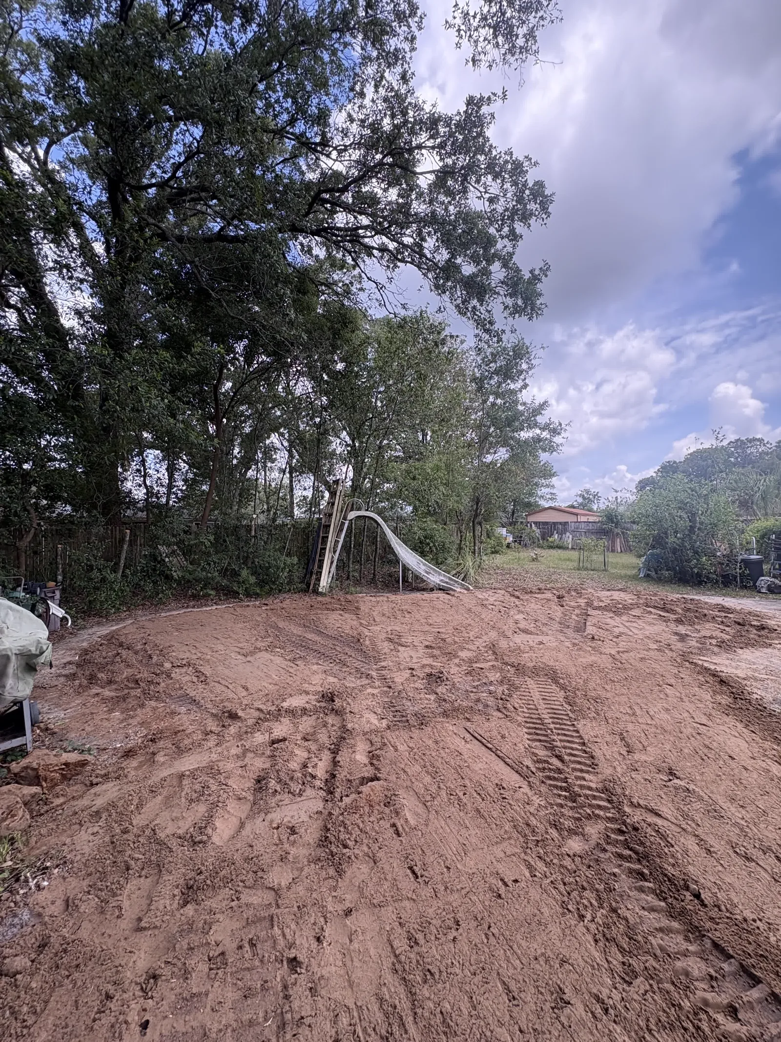 Backyard graded level after filling in a swimming pool in Middleburg FL