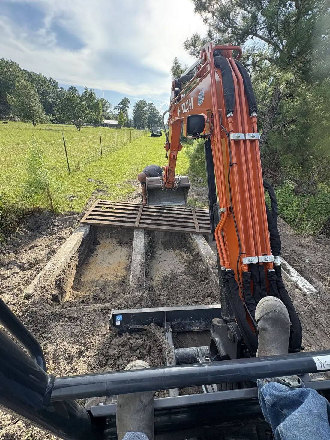 Excavator digging on residential site in North Central Florida